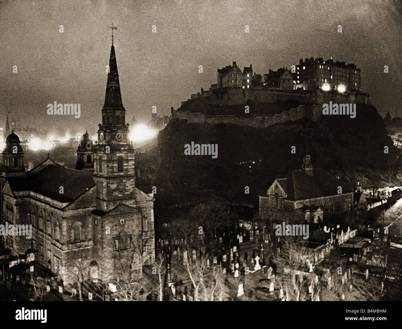 Edinburgh Castle Palace Prison and fortress It s so old that it s foundations go back to antiquity standing in it s shadows is a church and a graveyard Scenic eerie Atmospheric Night Circa 1940s Stock Photo