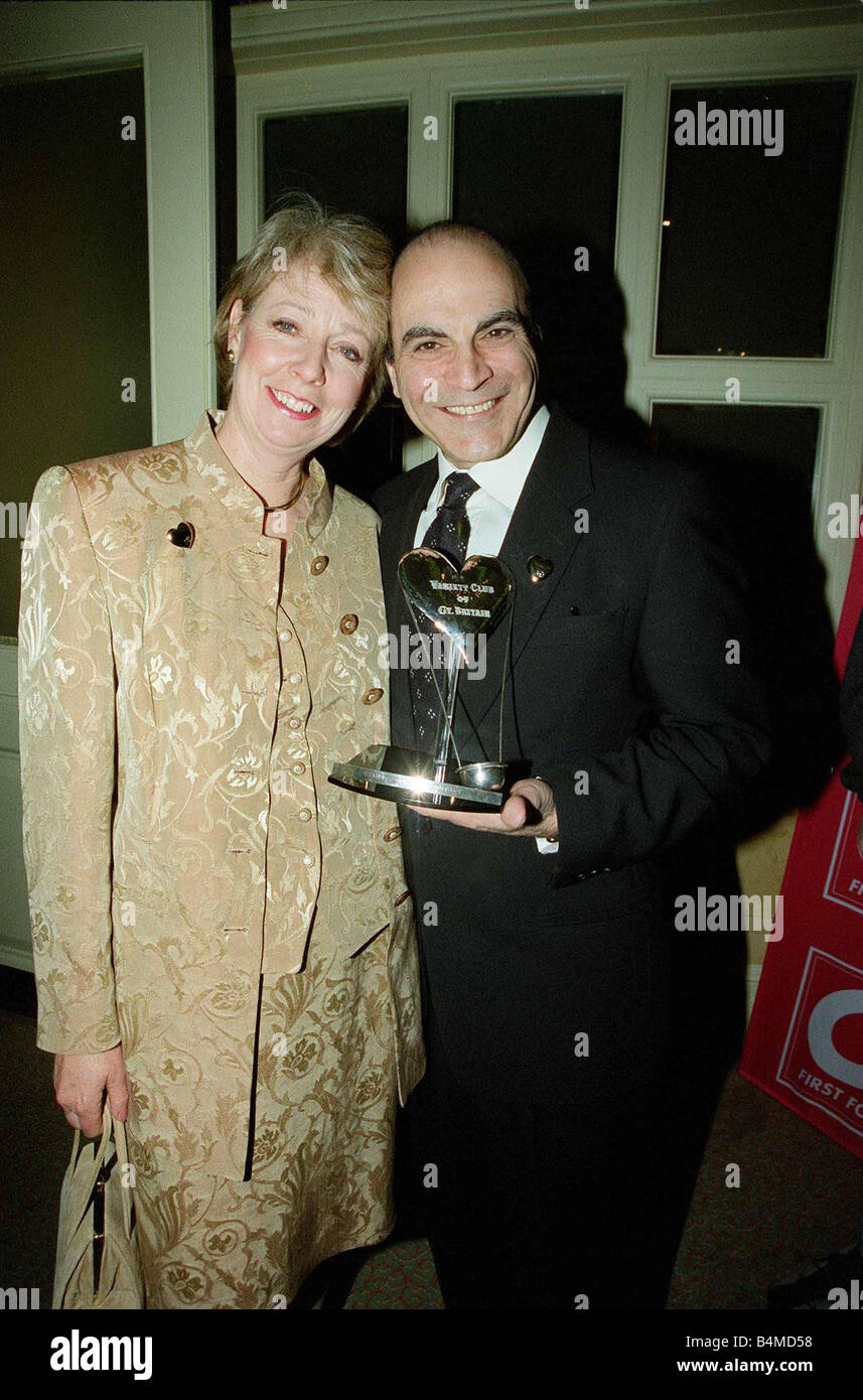 David Suchet actor at the London Hilton for the Variety Club of Great Britain show business awards 50th anniversary with his wife Sheila Suchet holding his award February 1999 Stock Photo