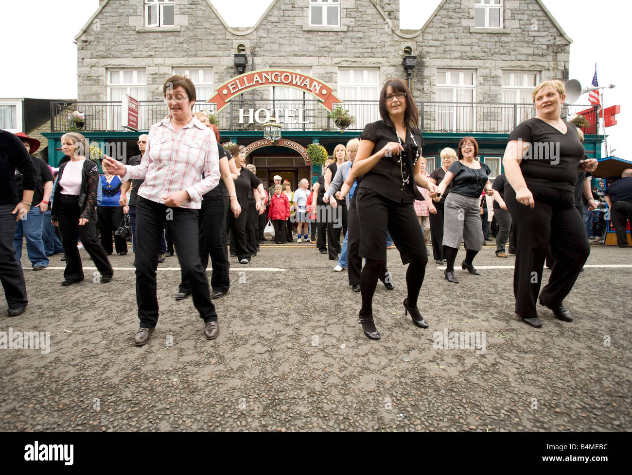 Line dancers dancing at Creetown Country Music Festival part of Gaelforce arts and entertainment festival Dumfries and Galloway Stock Photo