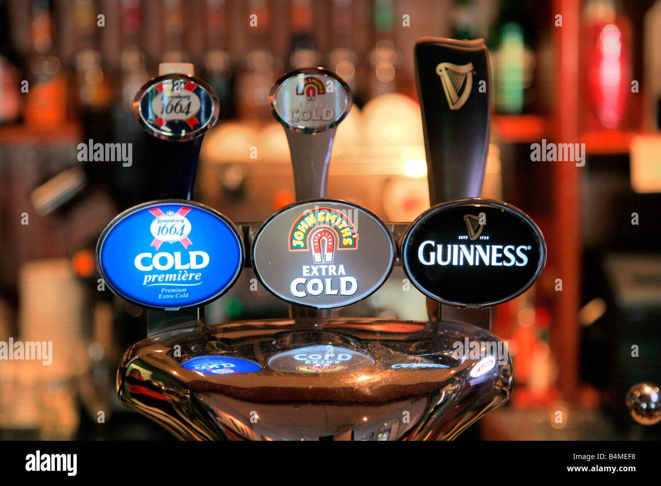 Beer Pumps in a public bar Guinness John Smiths Cold Kroneberg Beers
