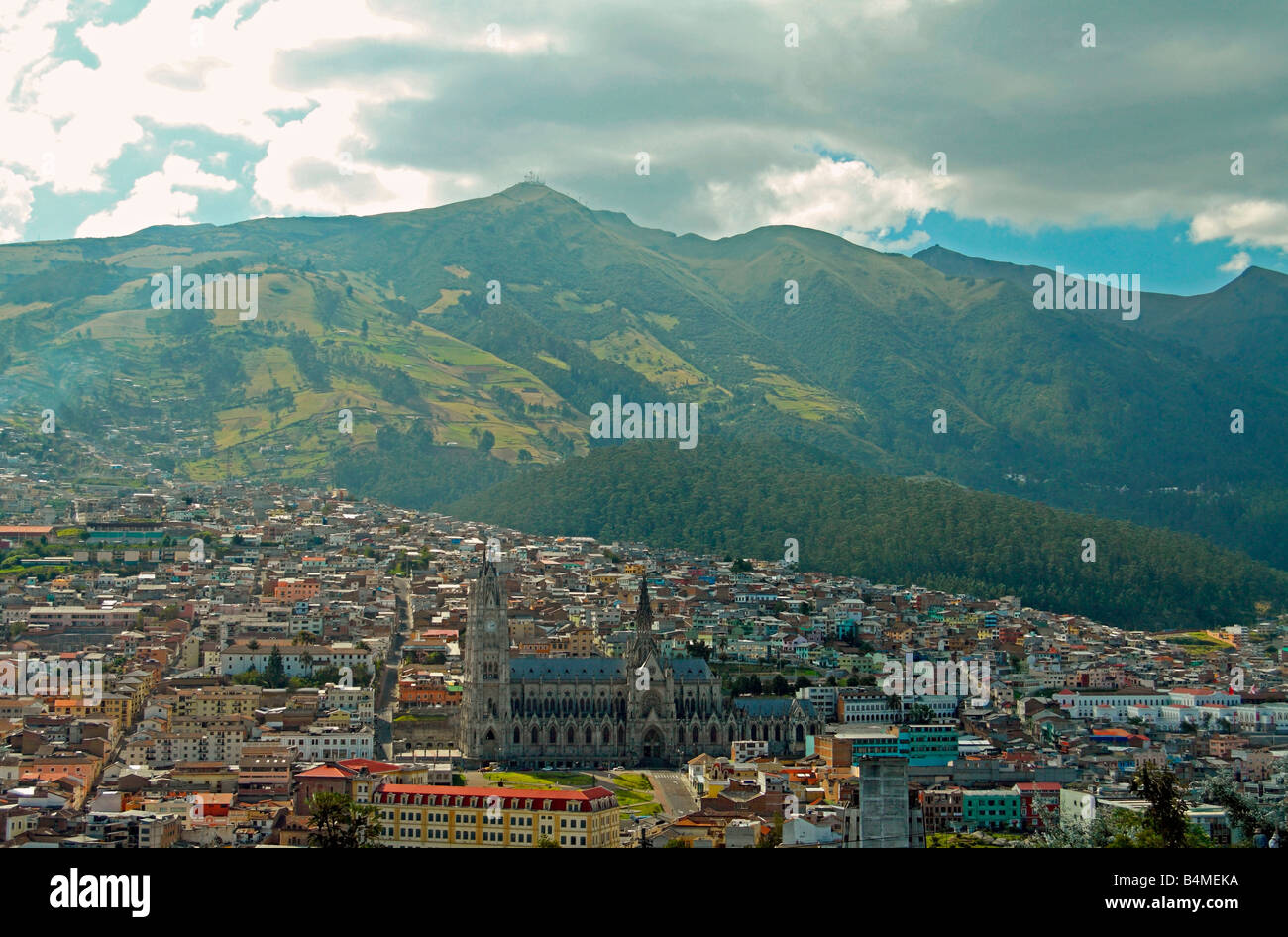 View of Quito's old town, Gothic cathedral and Pichincha volcano, from Itchimbia Park cultural centre, Ecuador Stock Photo