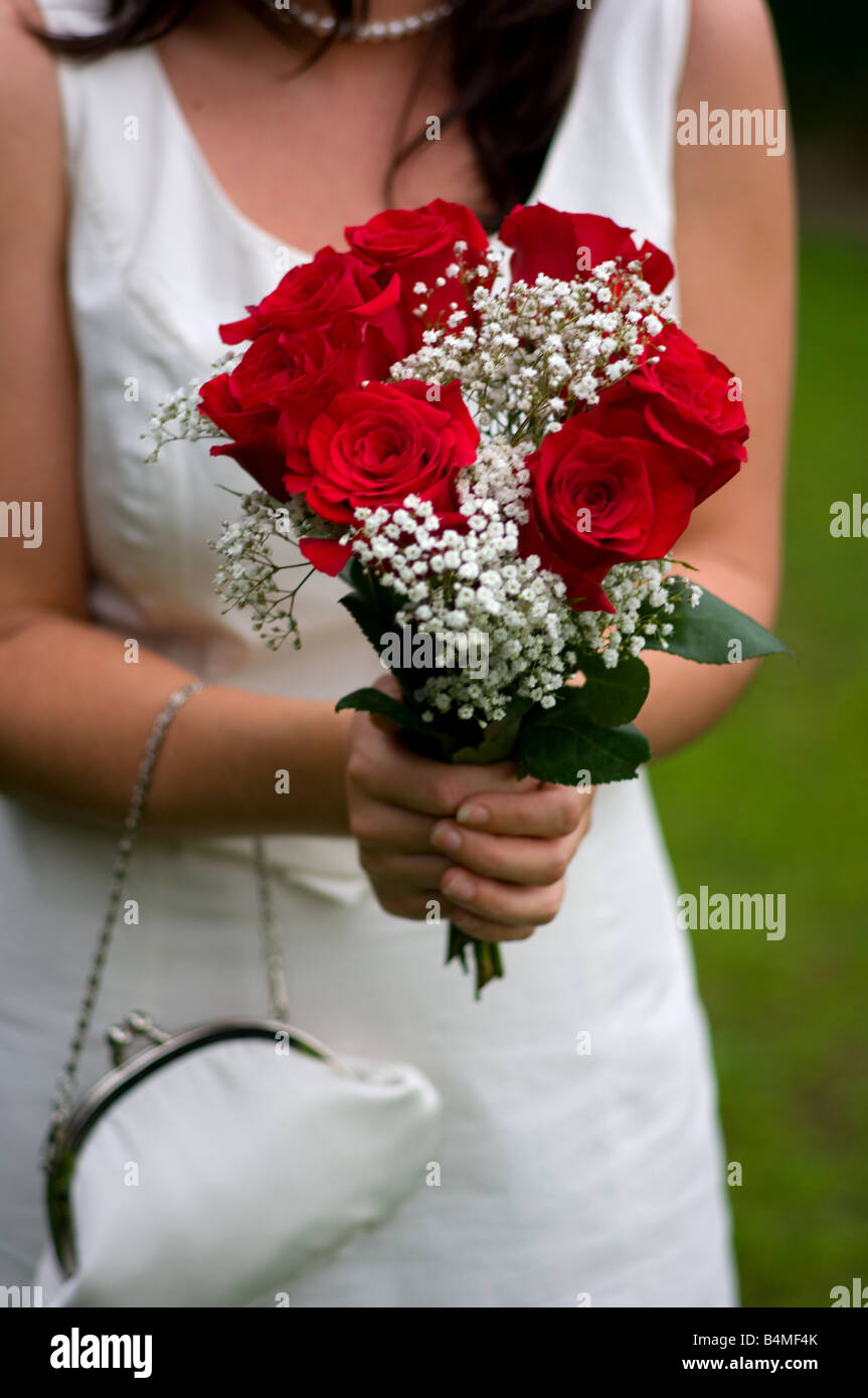 Bride holding wedding flowers Stock Photo Alamy