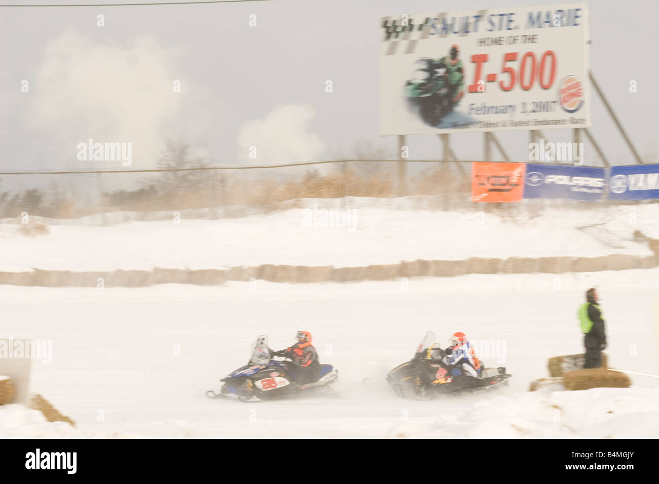 Snowmobile racing action at the I 500 Snowmobile race in Sault Ste Marie Michigan Stock Photo