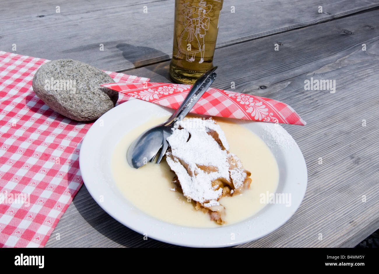 Apple strudel with vanilla sauce and Almdudler lemonade Stock Photo