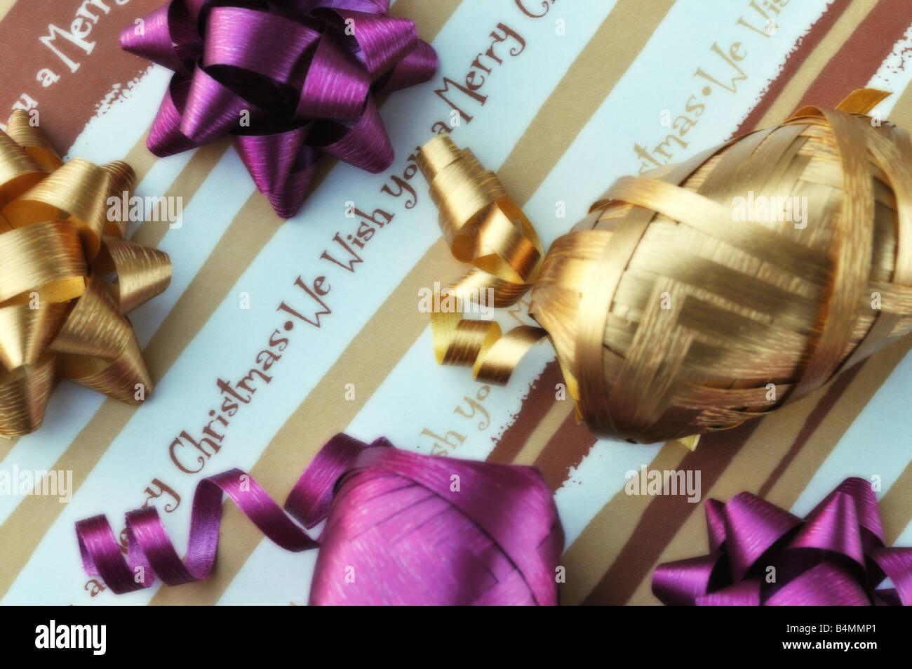 Christmas wrapping paper with colourful ribbon and bows Stock Photo Alamy