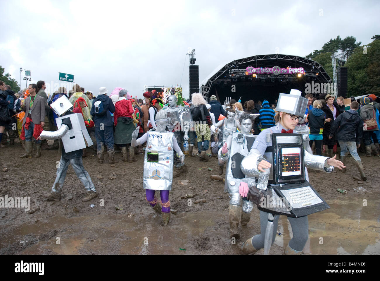 Group of people dressed up as a computers, walking in a mud, Bestival , Isle of wight UK 2008 Stock Photo