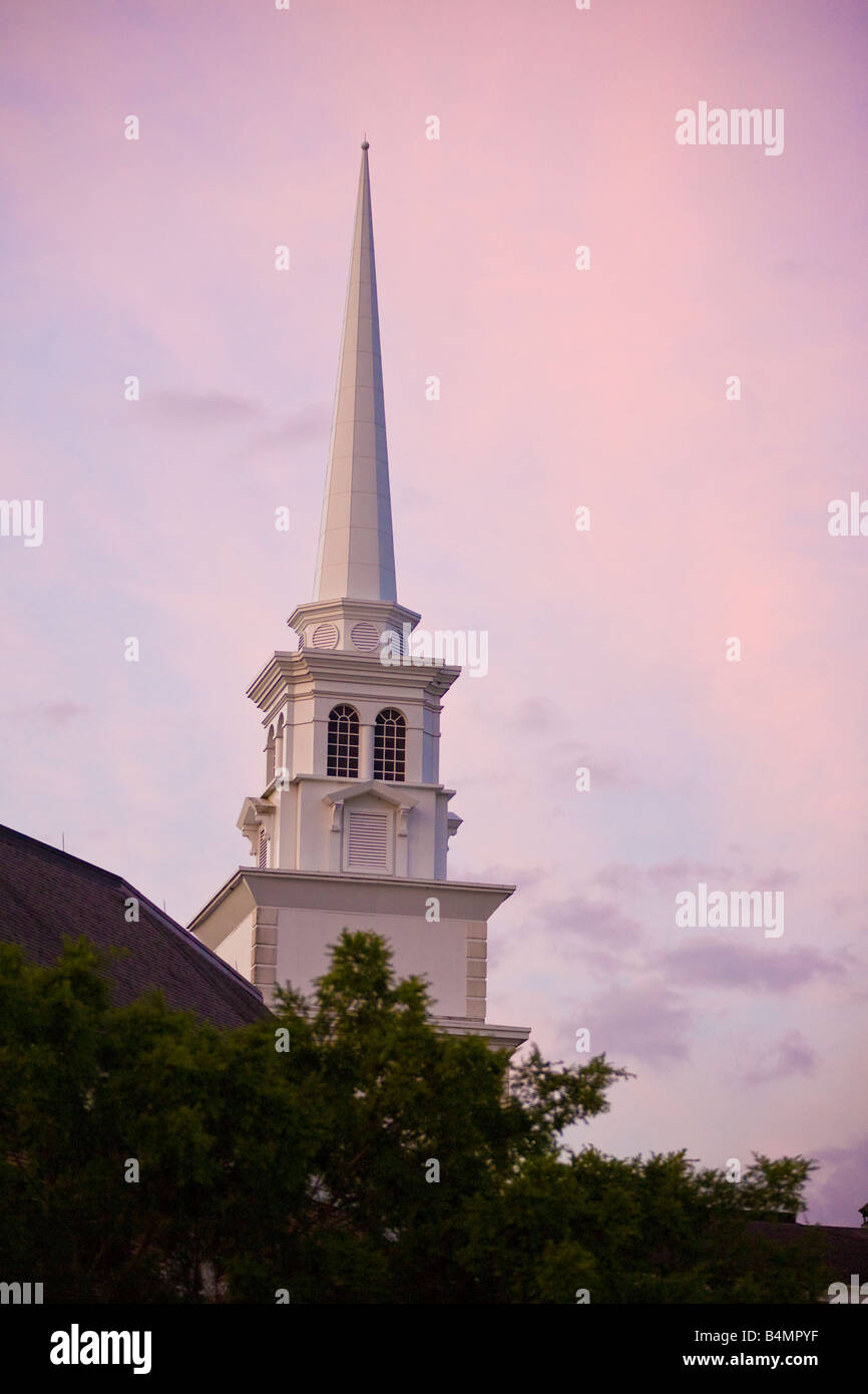 White church steeple against a pink and blue sky Stock Photo