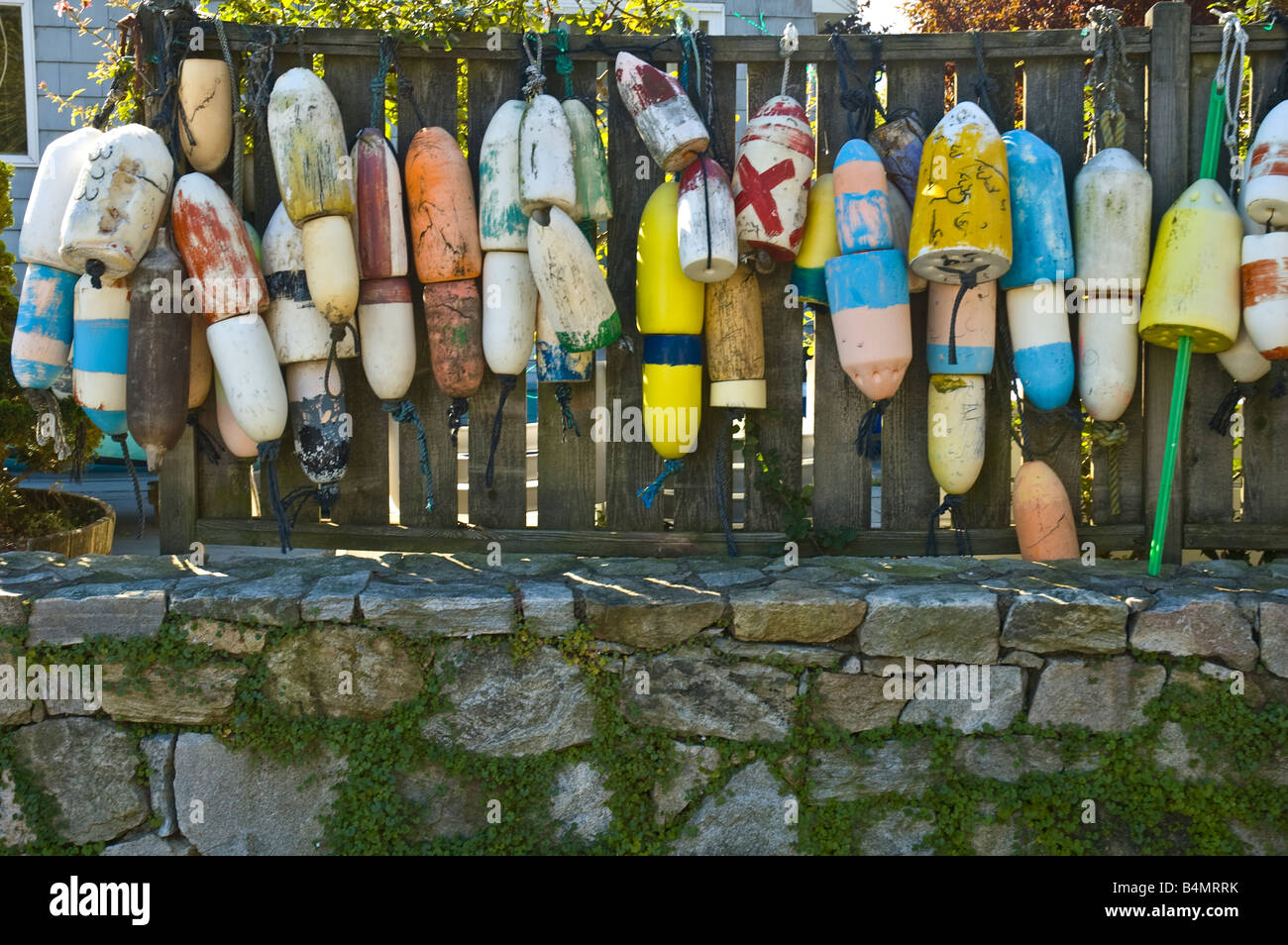 lobster trap floats hanging from a fence Stock Photo Alamy