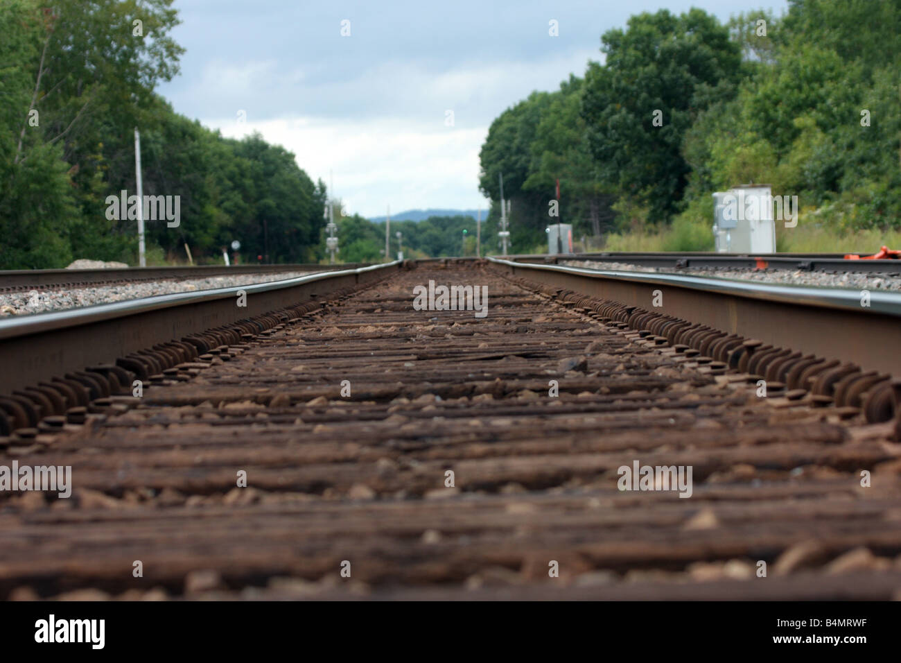 Railroad ties in foreground in focus Stock Photo