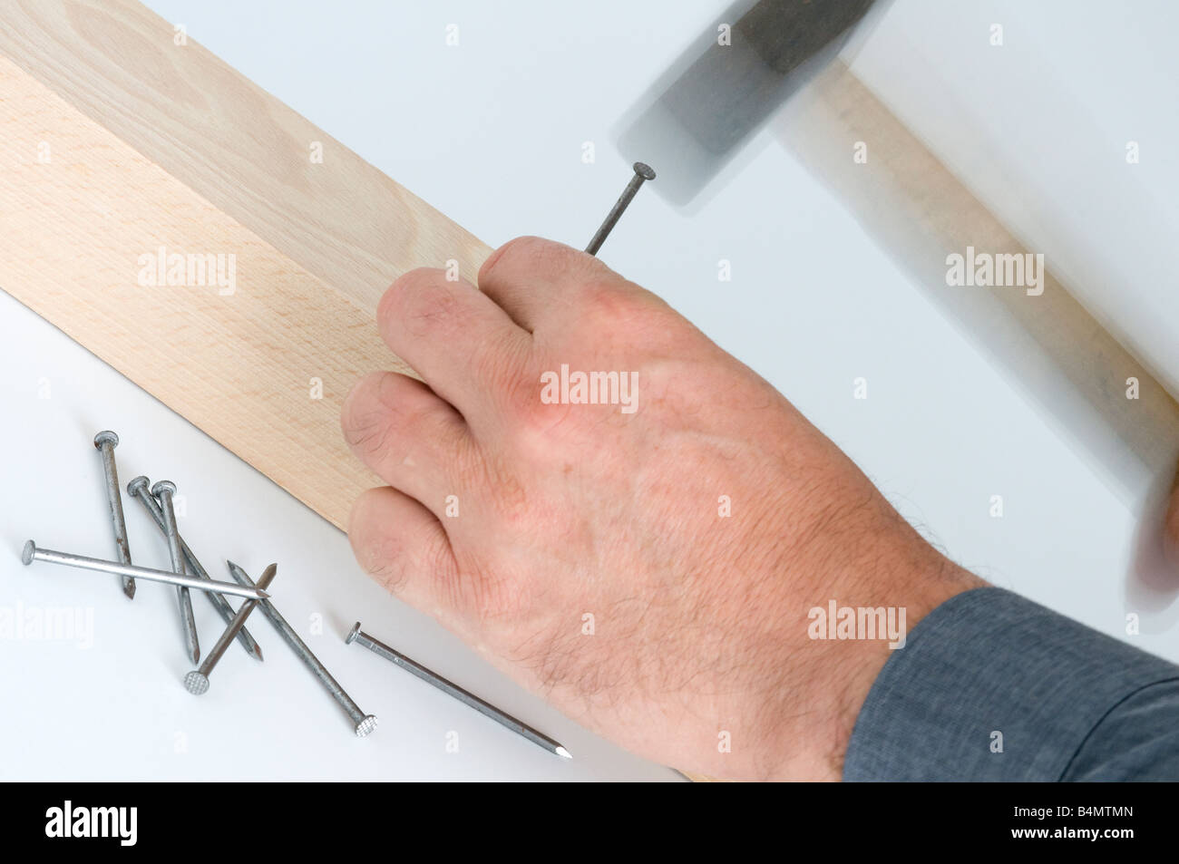 drive a nail with the hammer Stock Photo Alamy