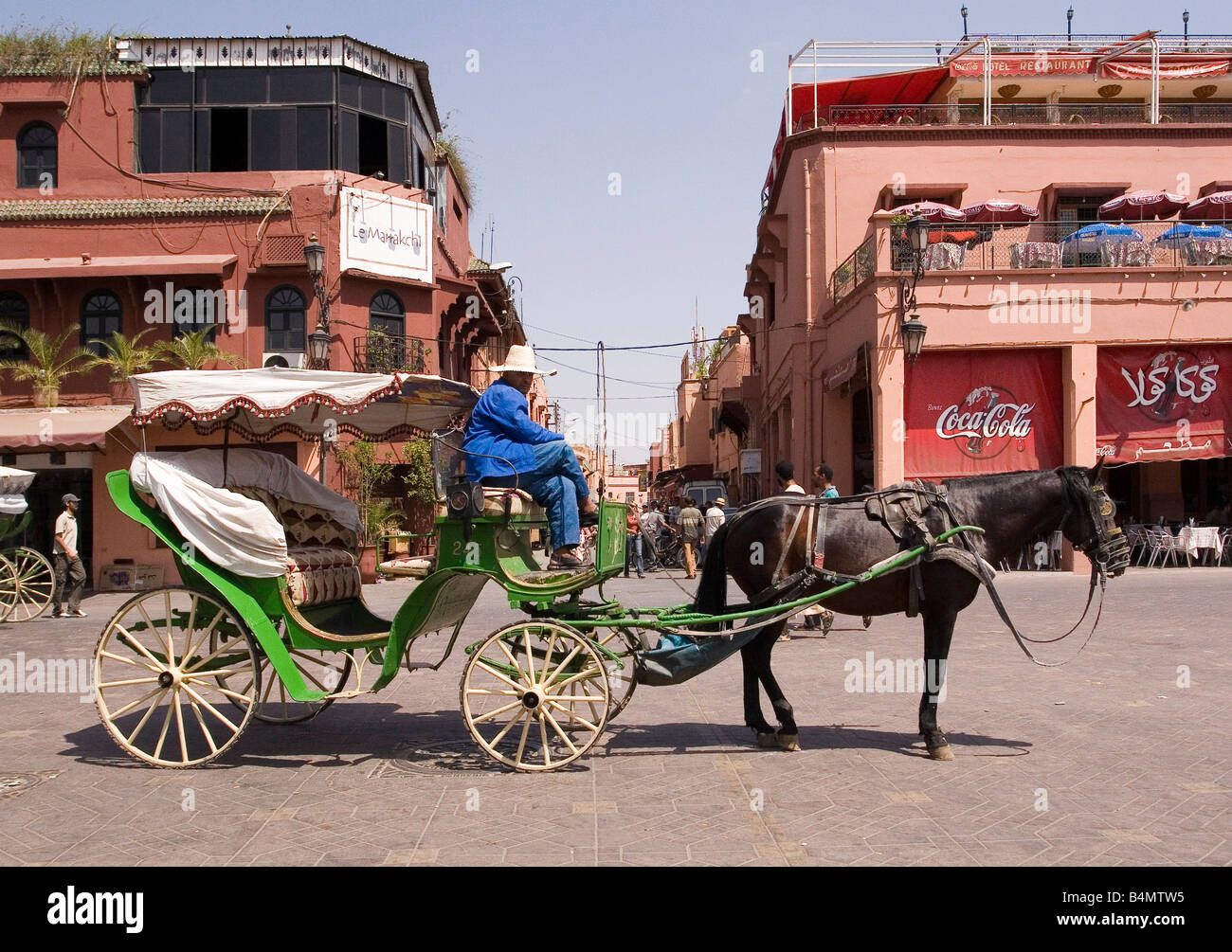 Horse cart driver waiting in the heat for clients, Djemaa El Fna square