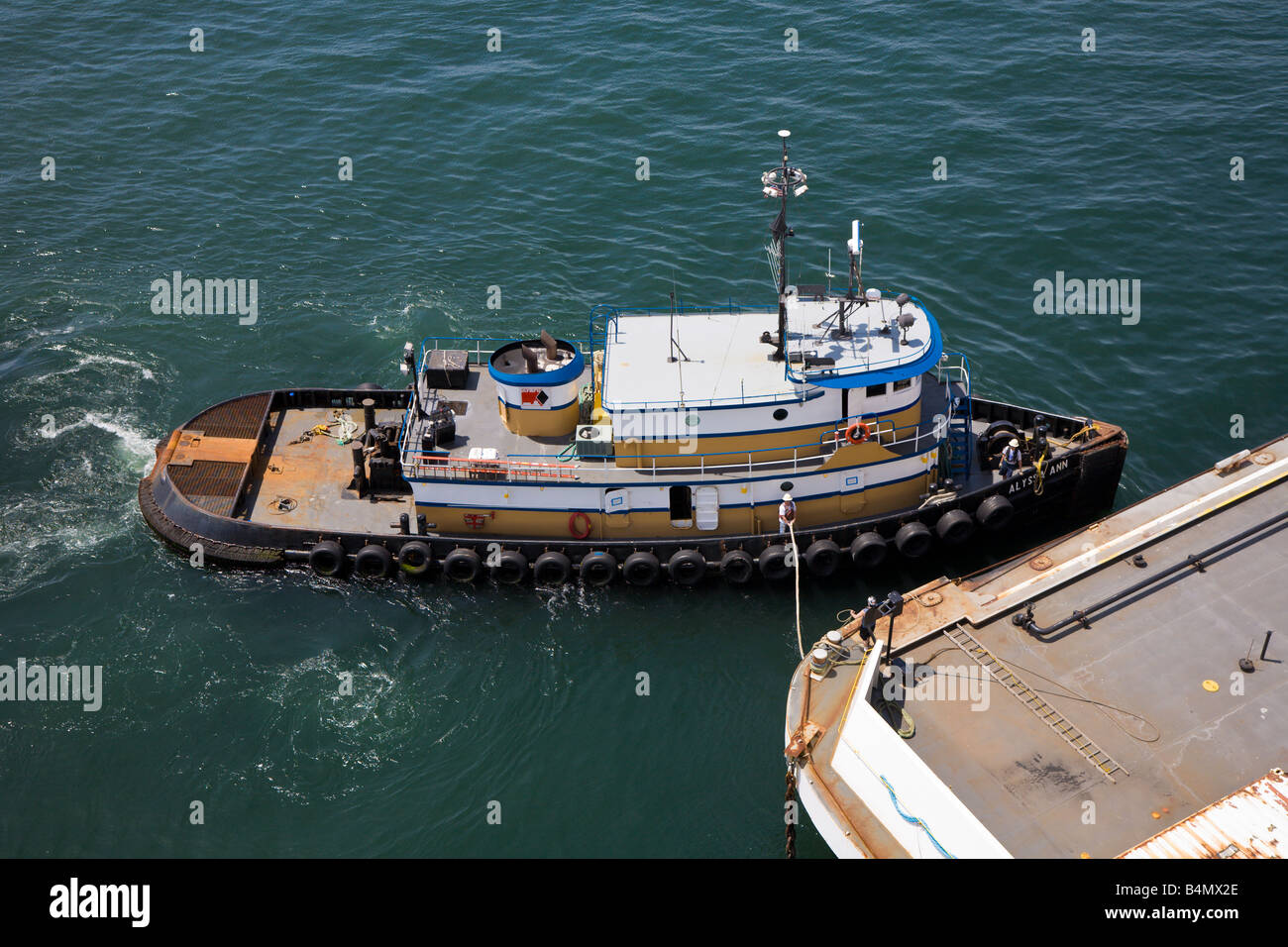 Tug Boat Pushes Fuel Barge Into Position To Refuel Cruise Ship Stock Photo Alamy