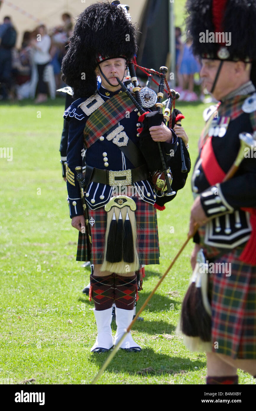 Piper in traditional Scottish dress with bagpipes, Harpenden Highland Gathering 2008 Stock Photo
