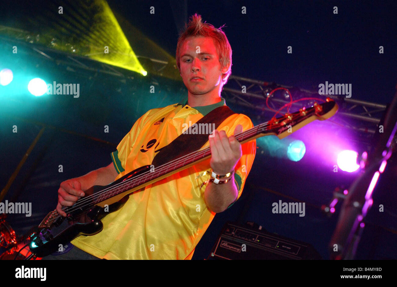 T in the Park 12th July 2003 Cowdenbeath striker Graeme Brown playing bass for his band Mydas at the T Break tent at T in the Park Graeme is wearing his Cowdenbeath top T in the Park Mydas Graeme Brown Stock Photo