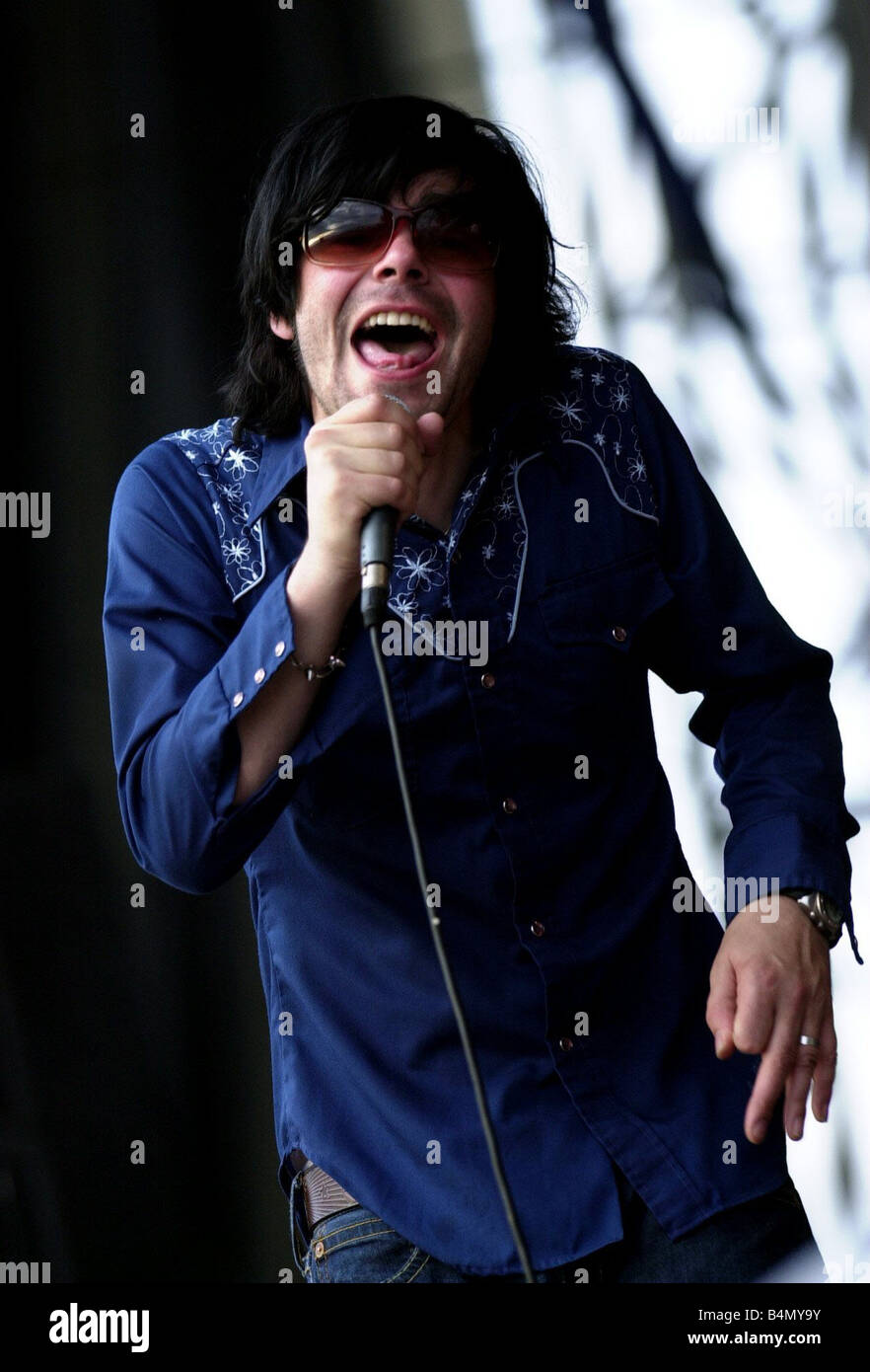 Tim Burgess onstage at T In The Park July 2003 Stock Photo