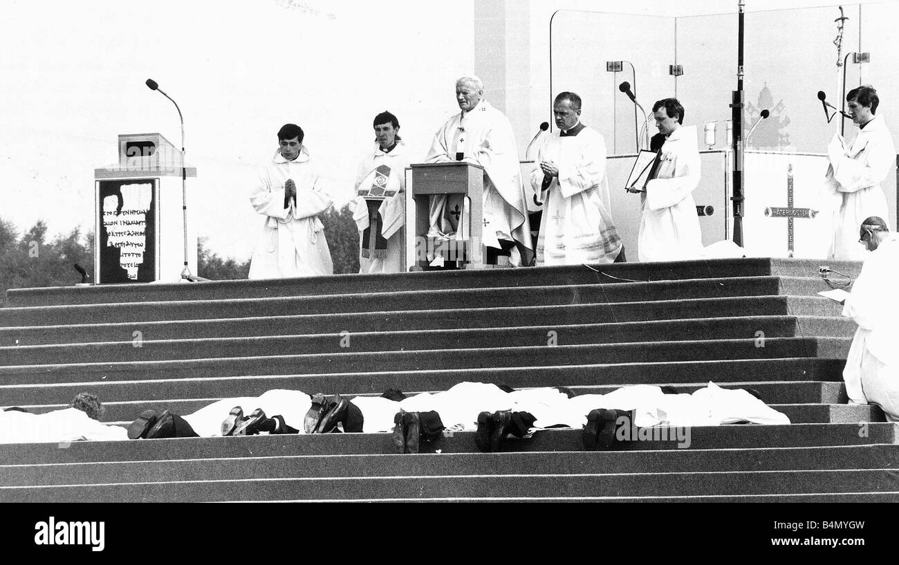 Priests to be ordained prostrate themselves before Pope John Paul II at Heaton Park near Manchester in 1982 Stock Photo