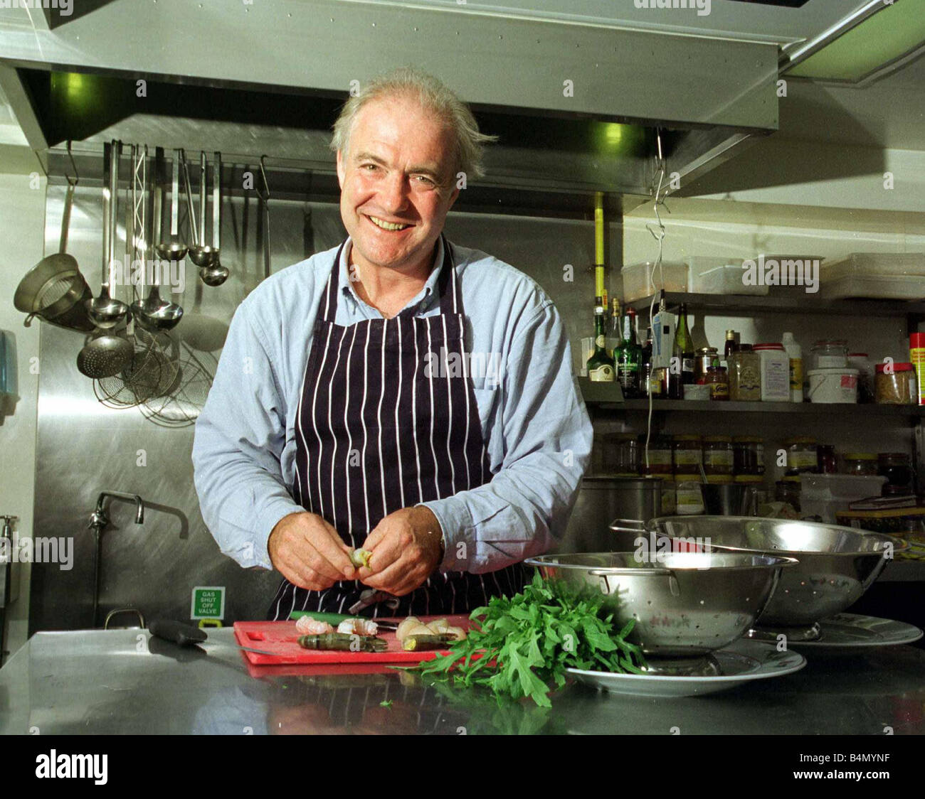 Rick Stein Chef TV Presenter June 1999 working in his kitchen Stock Photo