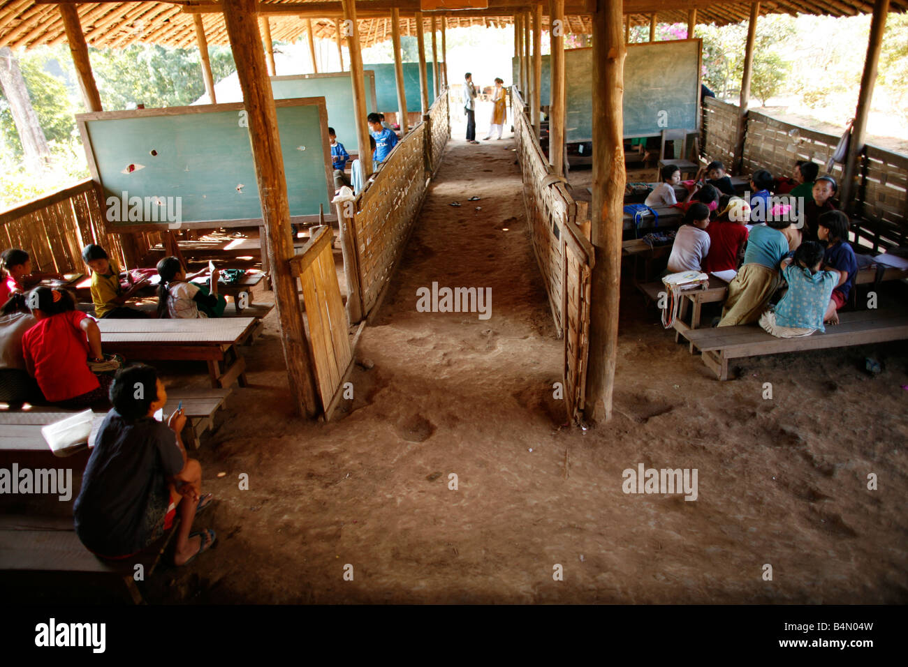 View of classrooms at the village school in La Per Her In Myanmar Burma thousands of people have settled near the border as a result of oppression in their homeland Around 200 Burmese displaced people have settled in La Per Her a village on the Burmese side of the border with Thailand near the Thai town of Mae Sot They refuse to cross the border because they want to remain in their homeland These refugees support the rebel movement called KNLA Karen National Liberation Army which operates in eastern Burma Jan 2007 Stock Photo