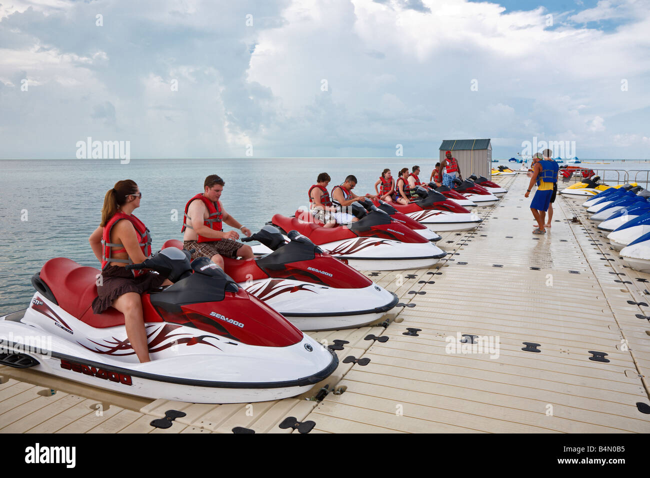 Cruise ship passengers get instruction before taking jet ski excursion