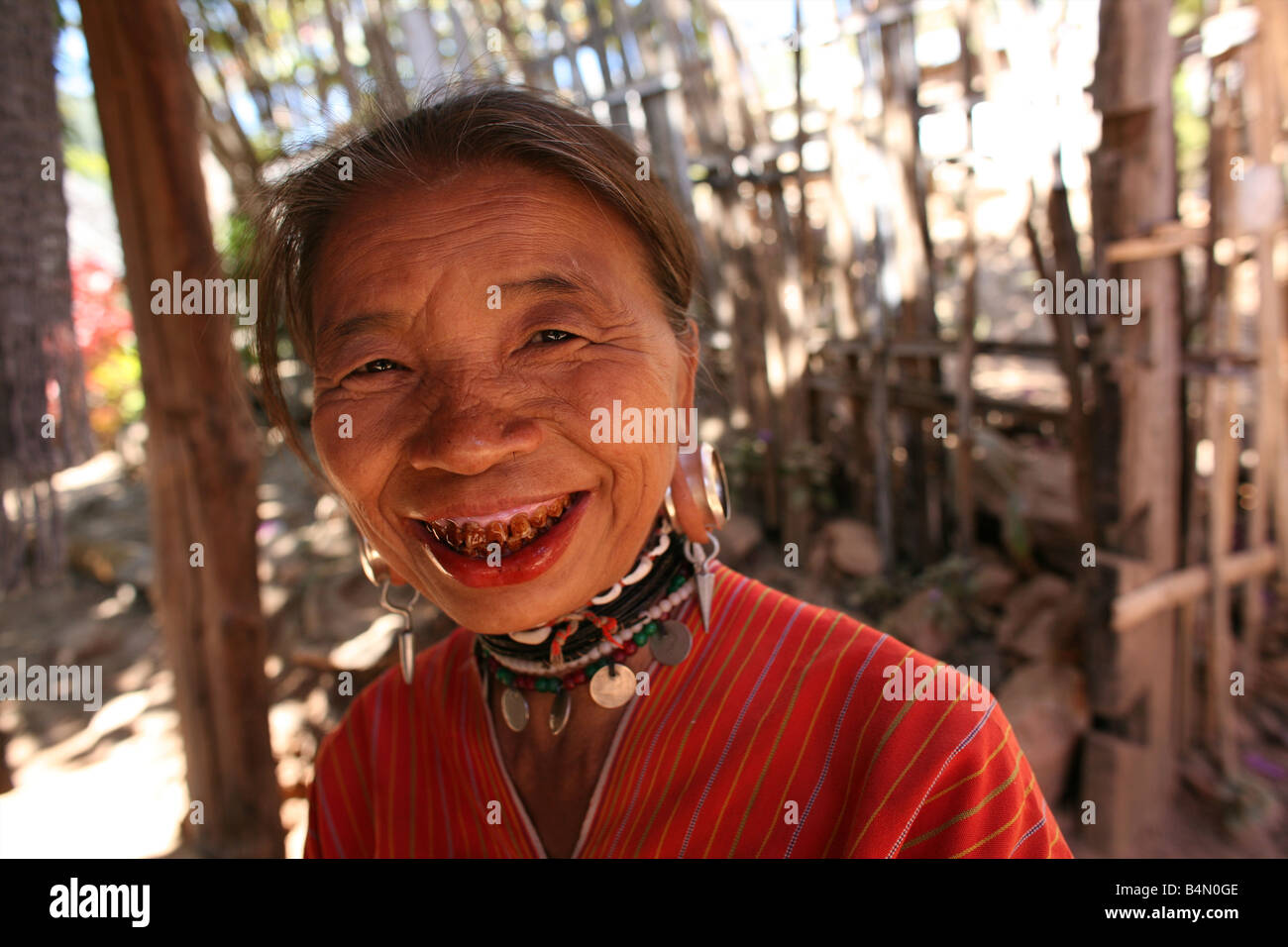 Portrait of an elderly village woman Approximately 300 Burmese refugees in Thailand are members of the indigenous group known as the Longnecks The largest of the three villages where the Longnecks live is called Nai Soi located near Mae Hong Son City Longnecks wear metal rings on their necks which push the collarbone done and extend the neck They are a tourist attraction Tourists visit Nai Soi to take pictures of the Longnecks and buy their handicrafts The villages are criticized by human rights organizations as human zoos Stock Photo