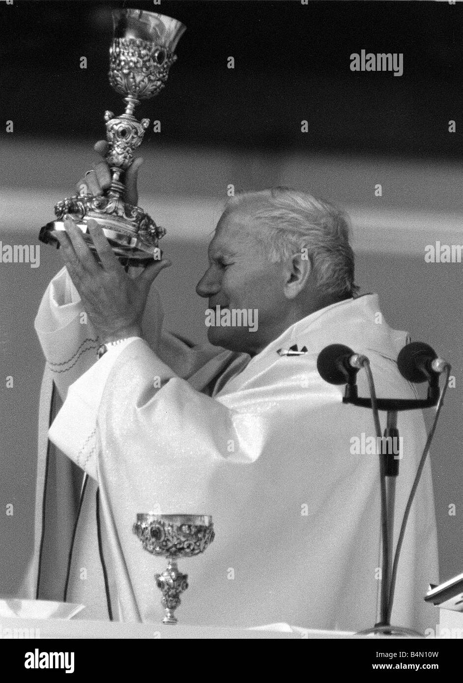 Pope John Paul II blessing the wine during an open air mass held at