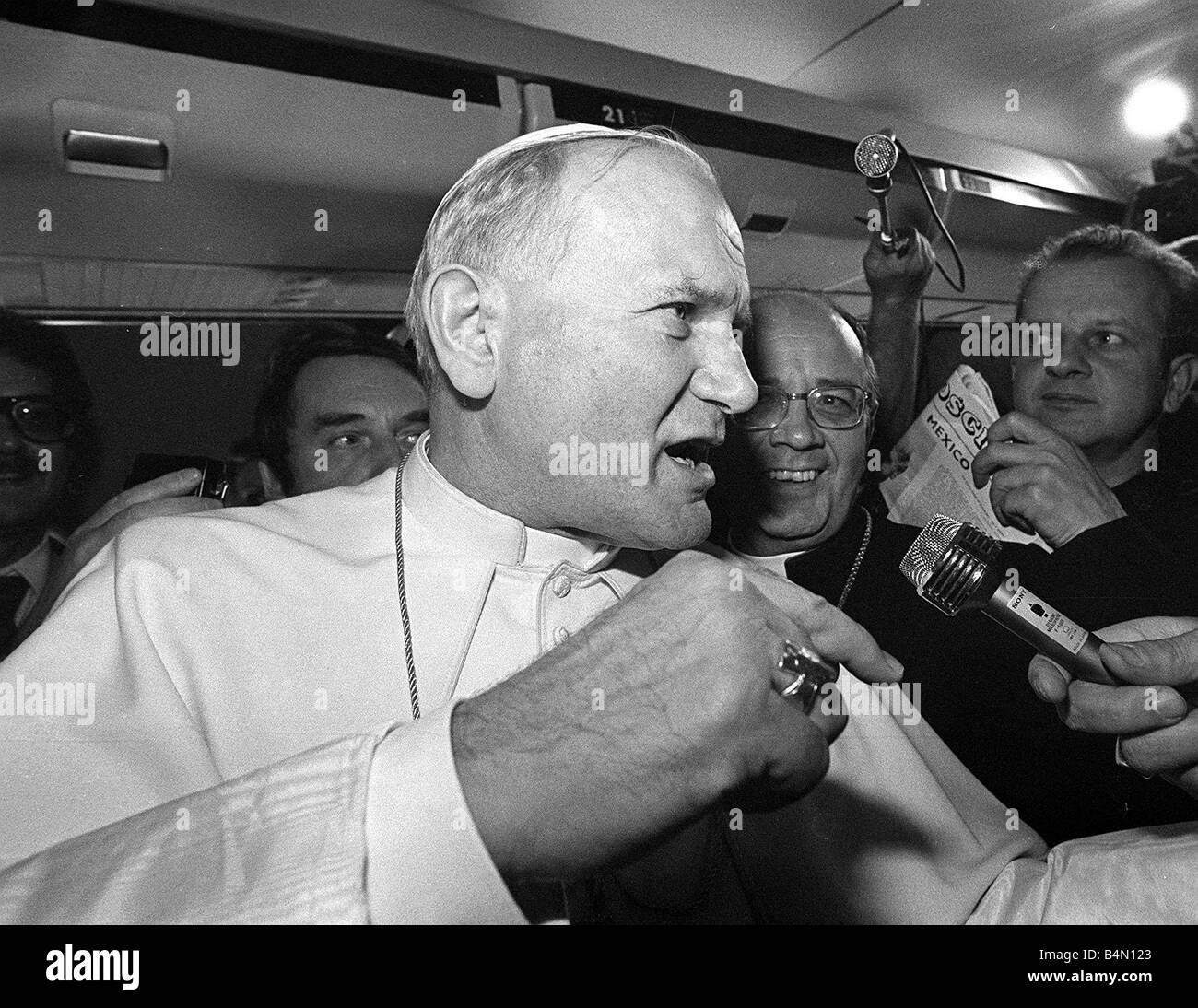 Pope John Paul II is interviewed during a flight on his visit to Ireland Stock Photo
