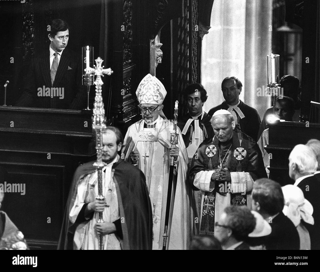 Pope John Paul II vist to Britian May 1982 Prince Charles watches as the Pope with the Archbishop makes his solemn entrance into the Cathedral Stock Photo