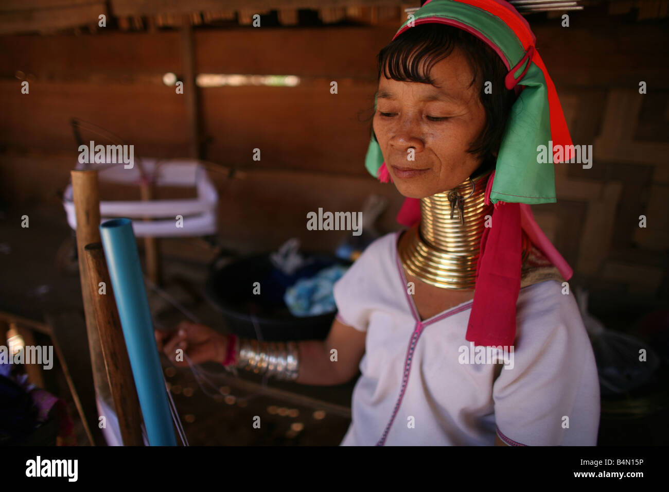 Closeup of a Longneck woman weaving Approximately 300 Burmese refugees