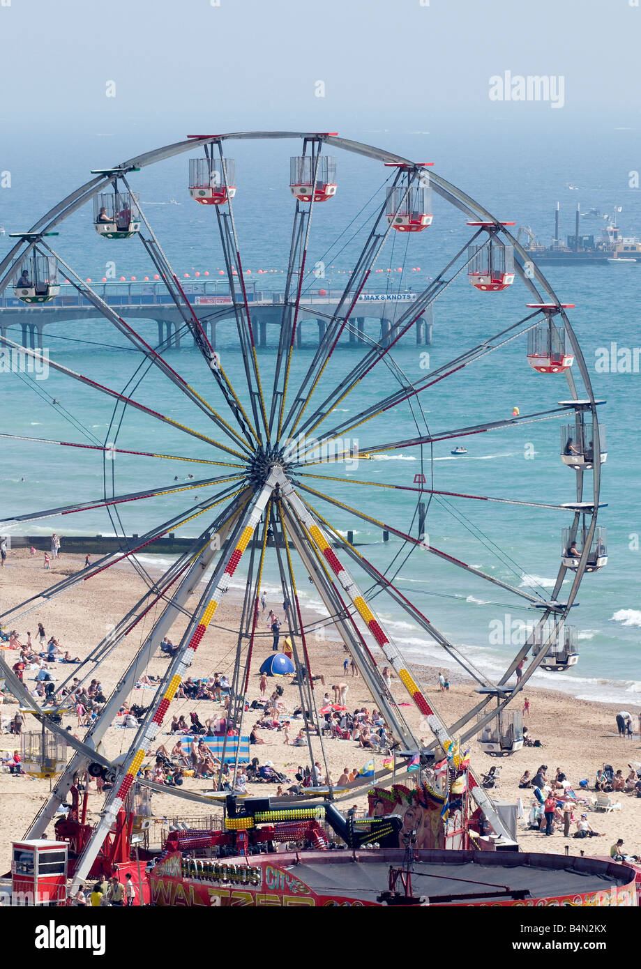 Fun fair on Boscombe beach showing Boscombe Pier and reef construction ...