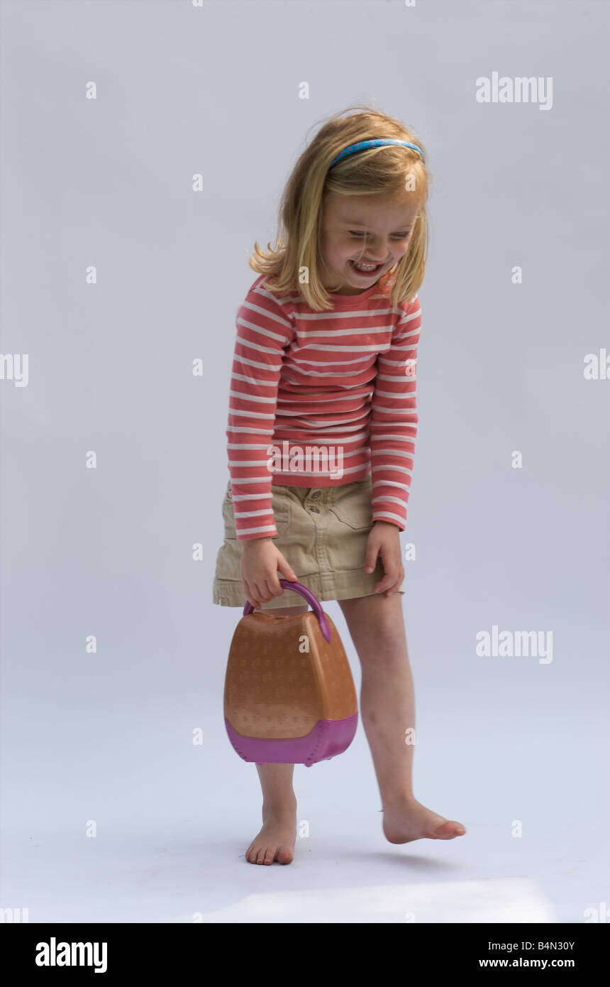 Four year old girl with handbag Stock Photo