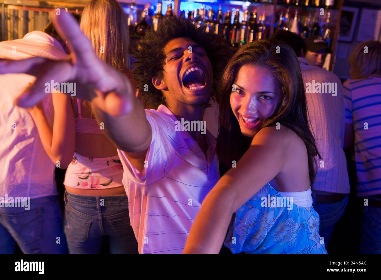 Young people dancing in a bar Stock Photo Alamy