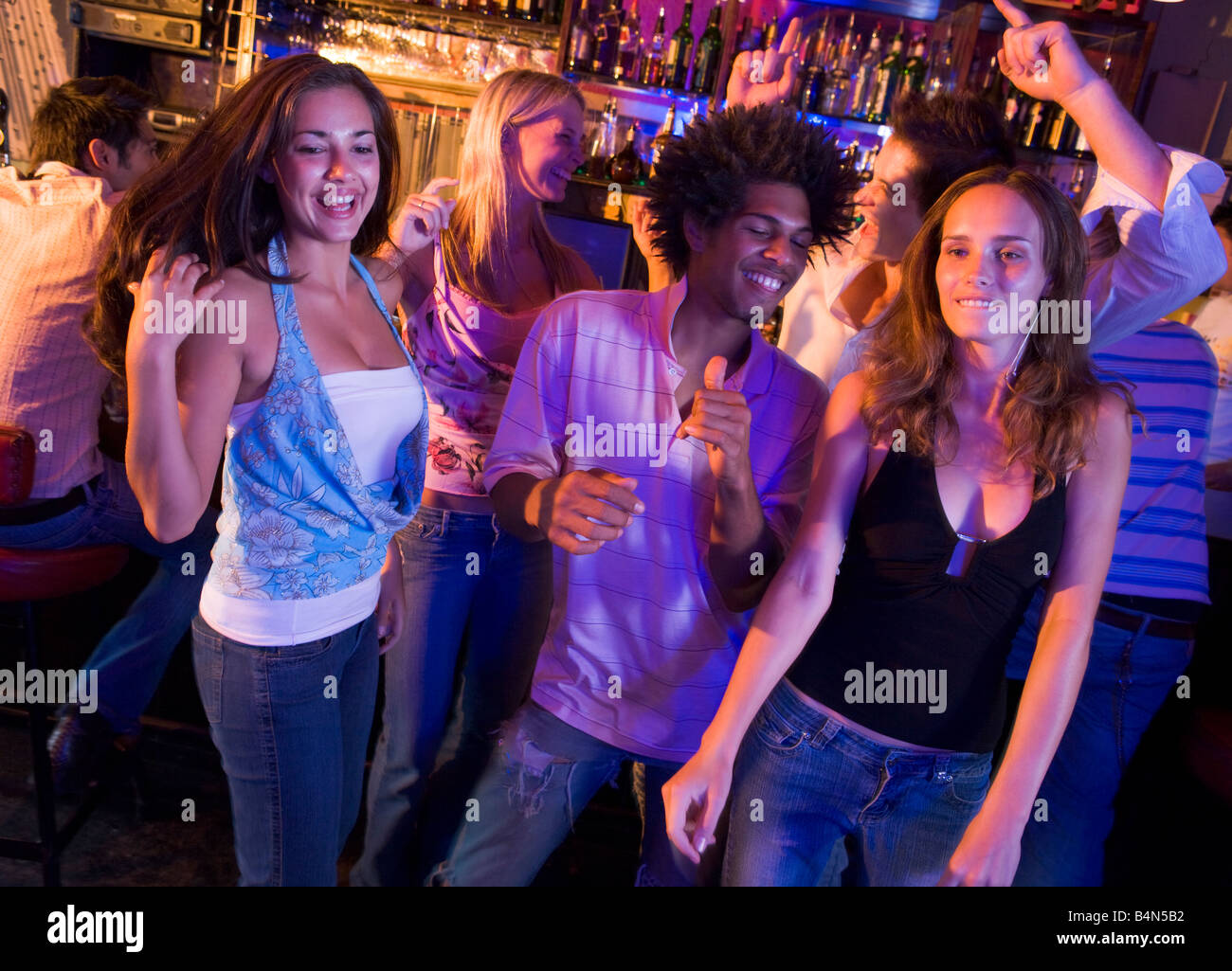 Young people dancing in a bar Stock Photo Alamy