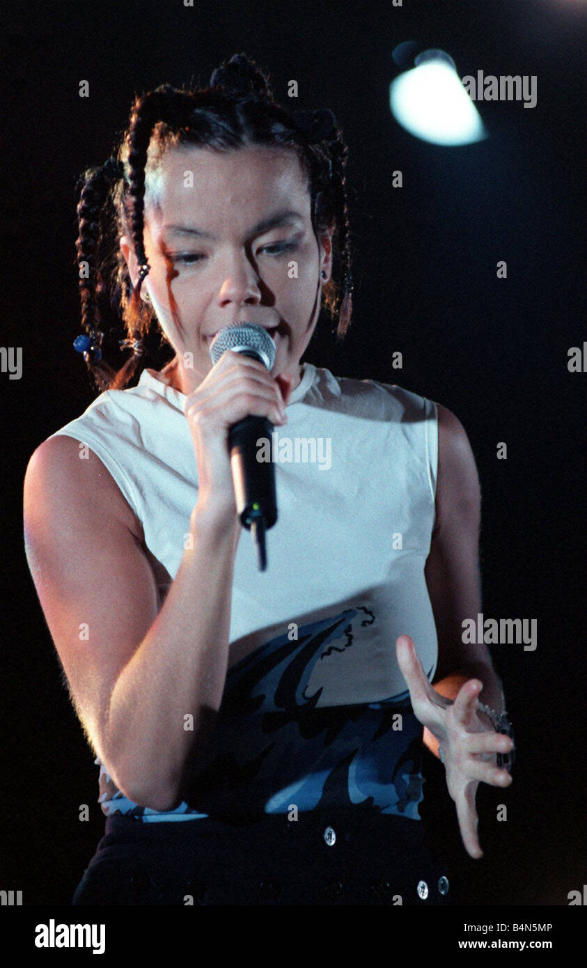 Bjork singer from Iceland on stage at the Irvine Festival with microphone in hand and pigtails in her hair Stock Photo