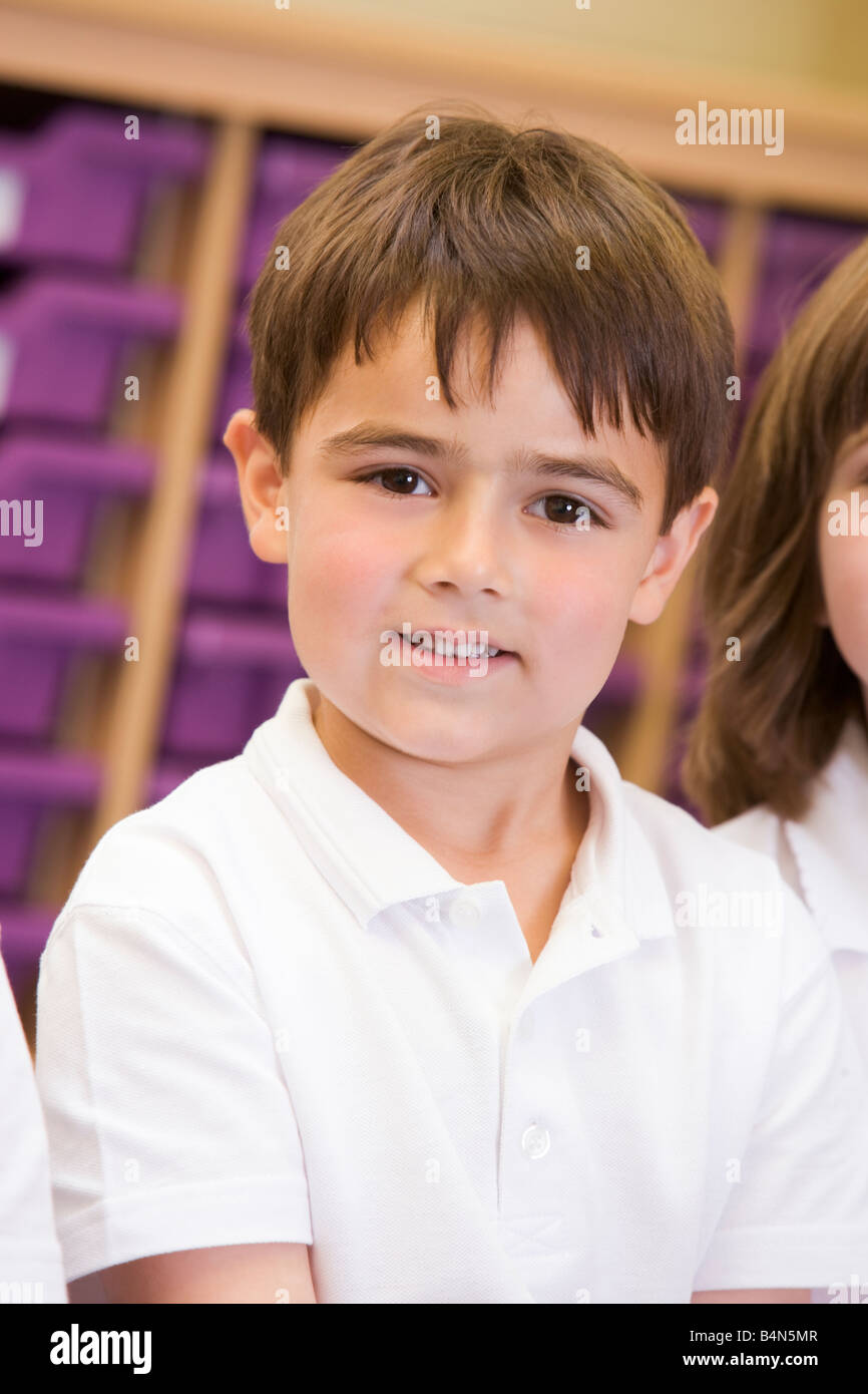 Student in class sitting on floor (selective focus) Stock Photo