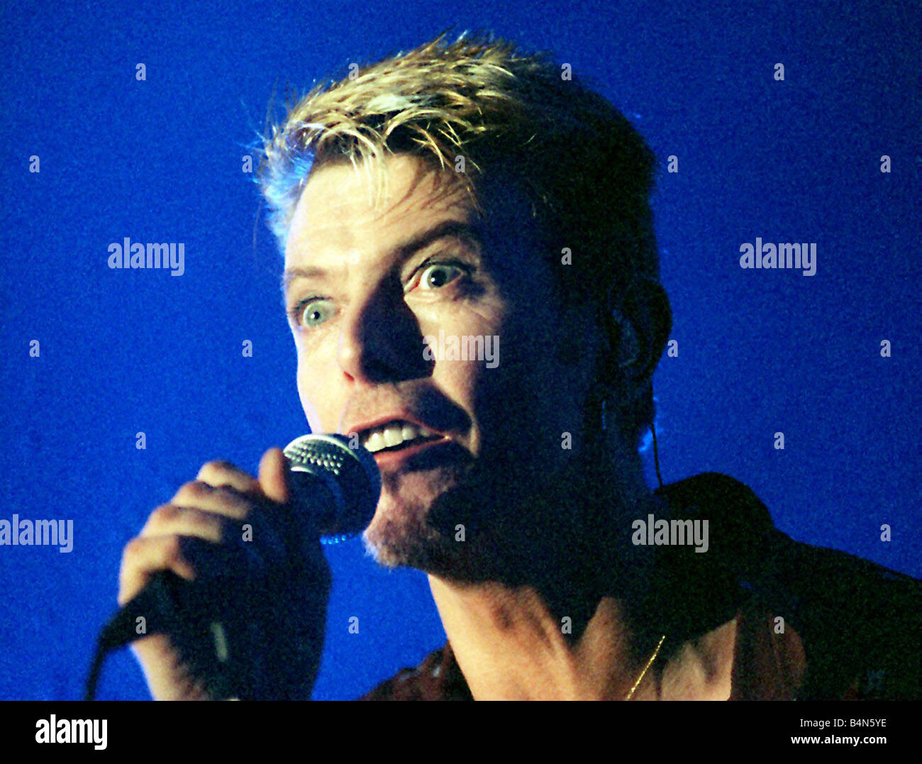 Singer David Bowie July 1997 singing live on stage at the Glasgow Barrowlands concert Stock Photo