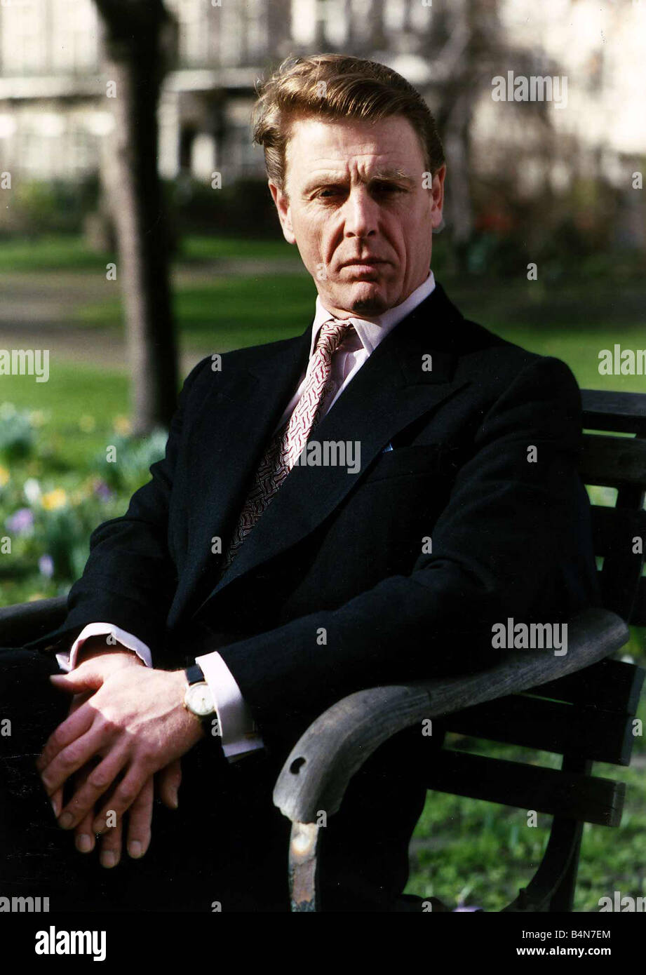 Edward Fox Actor Sitting On A Park Bench September 1989 Stock