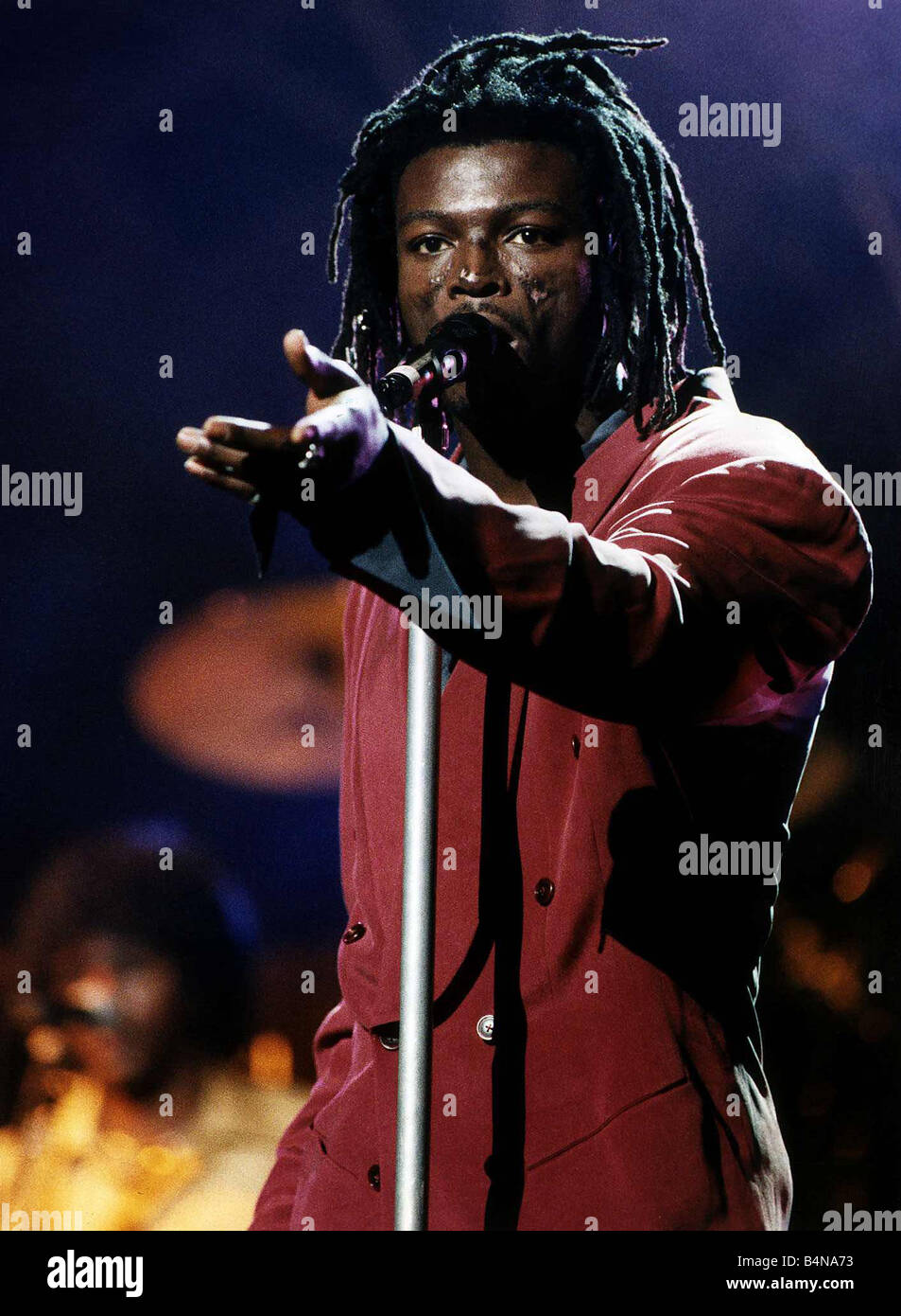 Seal singer on stage sings into microphone with dreadlocks Stock Photo 20138023 Alamy