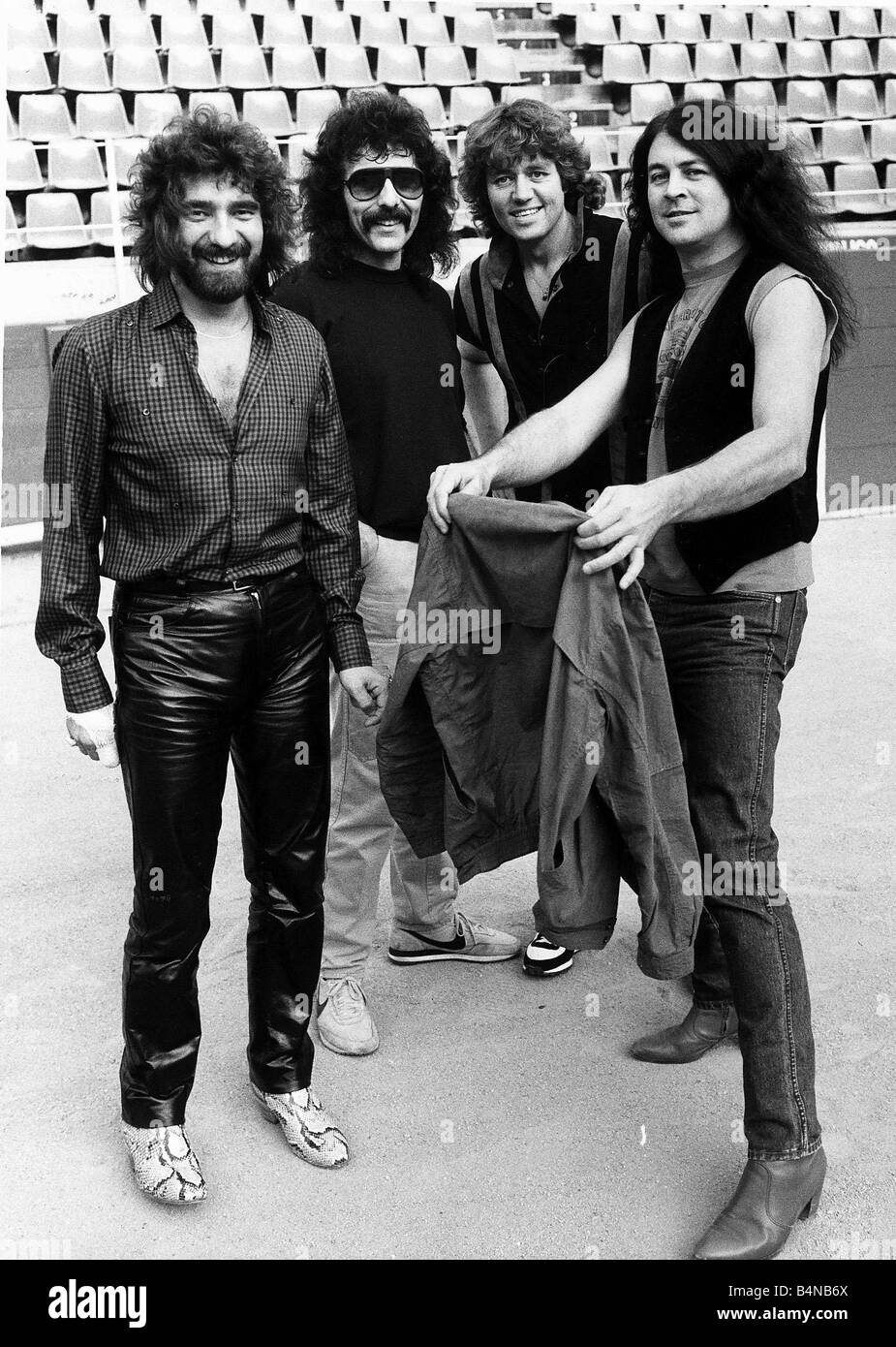 Ian Gillan singer with Black Sabbath pop rock group in 1983 and band from left Terry Geezer Butler Tony Lommi and Bev Bevan Stock Photo