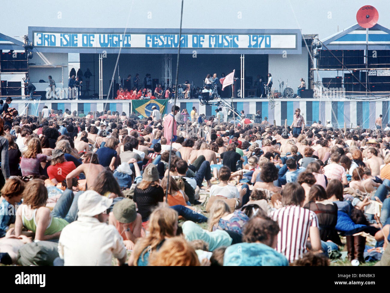 Music Pop Festivals Isle of Wight August 1970 3rd Isle of Wight Pop Festival crowds of people sitting on the grass watching the Stock Photo