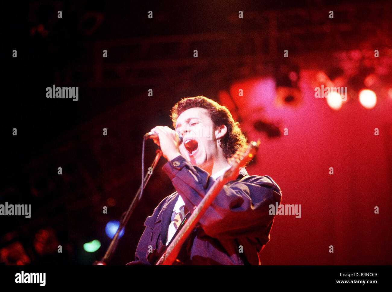 Tears For Fears Lead singer Roland Orzabal singing on stage Stock Photo