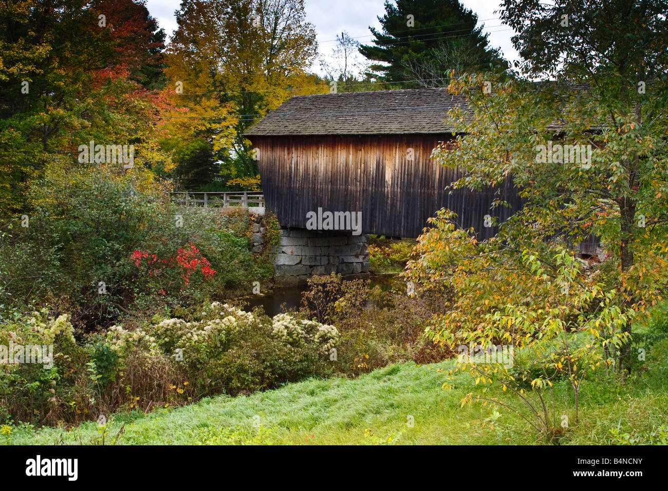 A wooden covered bridge Bradford New Hampshire on an autumn afternoon Stock Photo Alamy