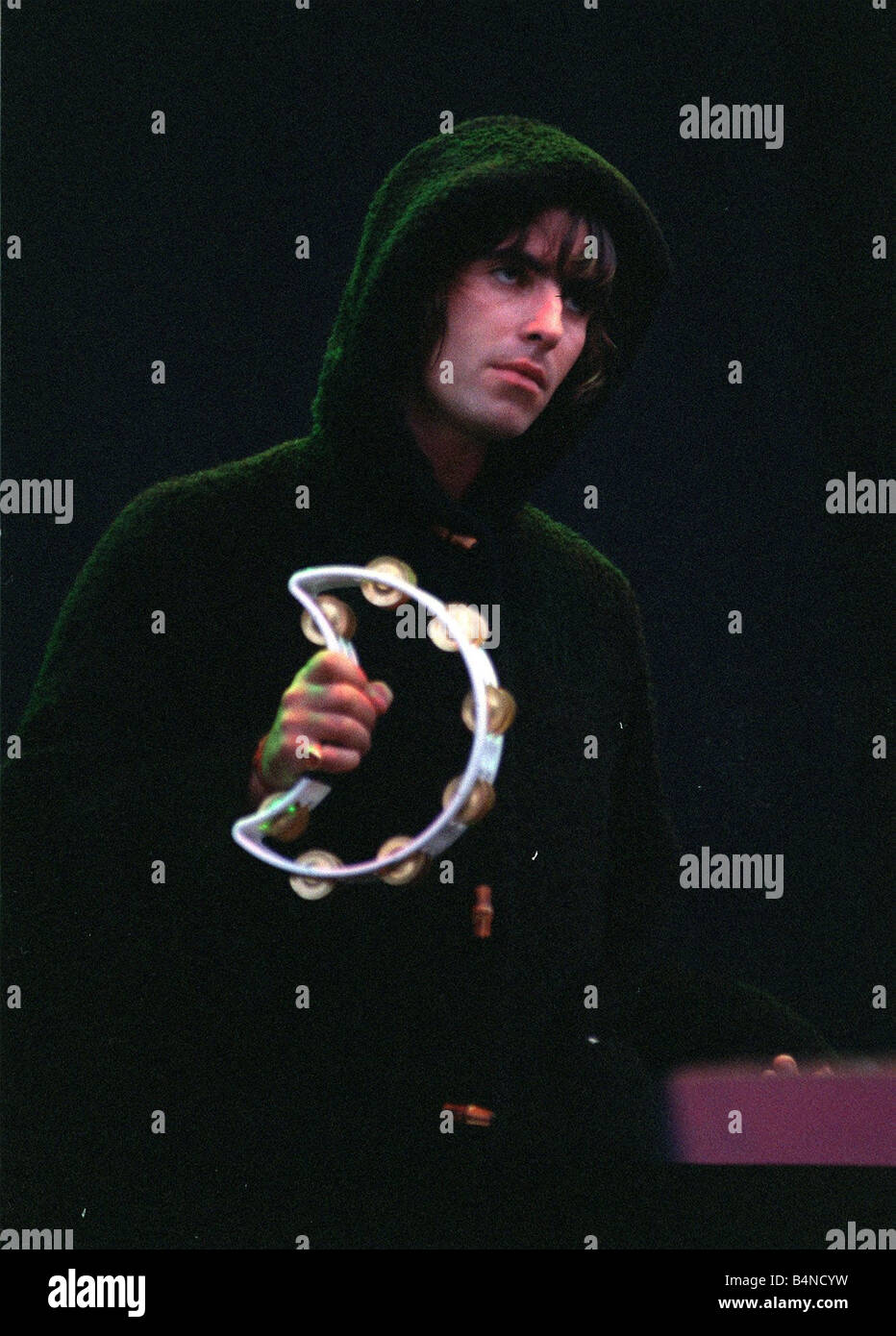 Liam Gallagher playing the tambourine during the Oasis concert at Balloch Country Park Loch Lomond August 1996 Stock Photo