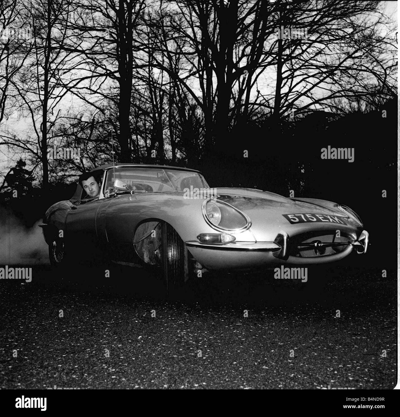 Bryan Forbes January 1964 in his E type Jaguar Stock Photo
