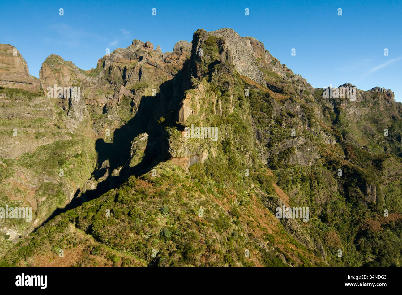 View of Pico Ruivo Madeira s highest summit from the slopes of Pico das Torres Stock Photo