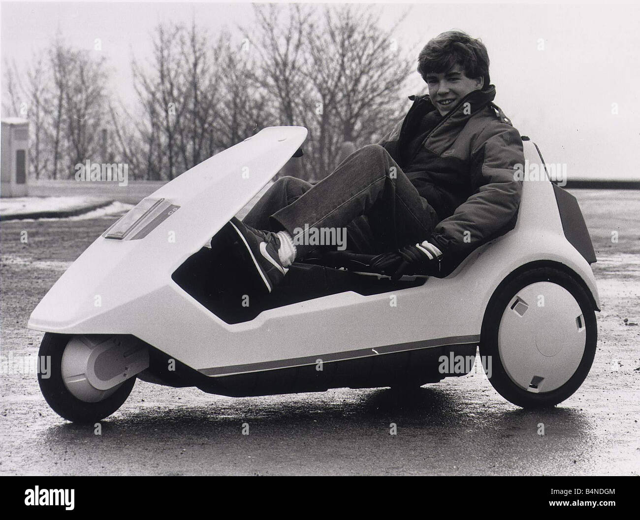 Sinclair C5 14 year old Joe Payne tryÍs out the C5 Battery powered tricycle  Stock Photo - Alamy