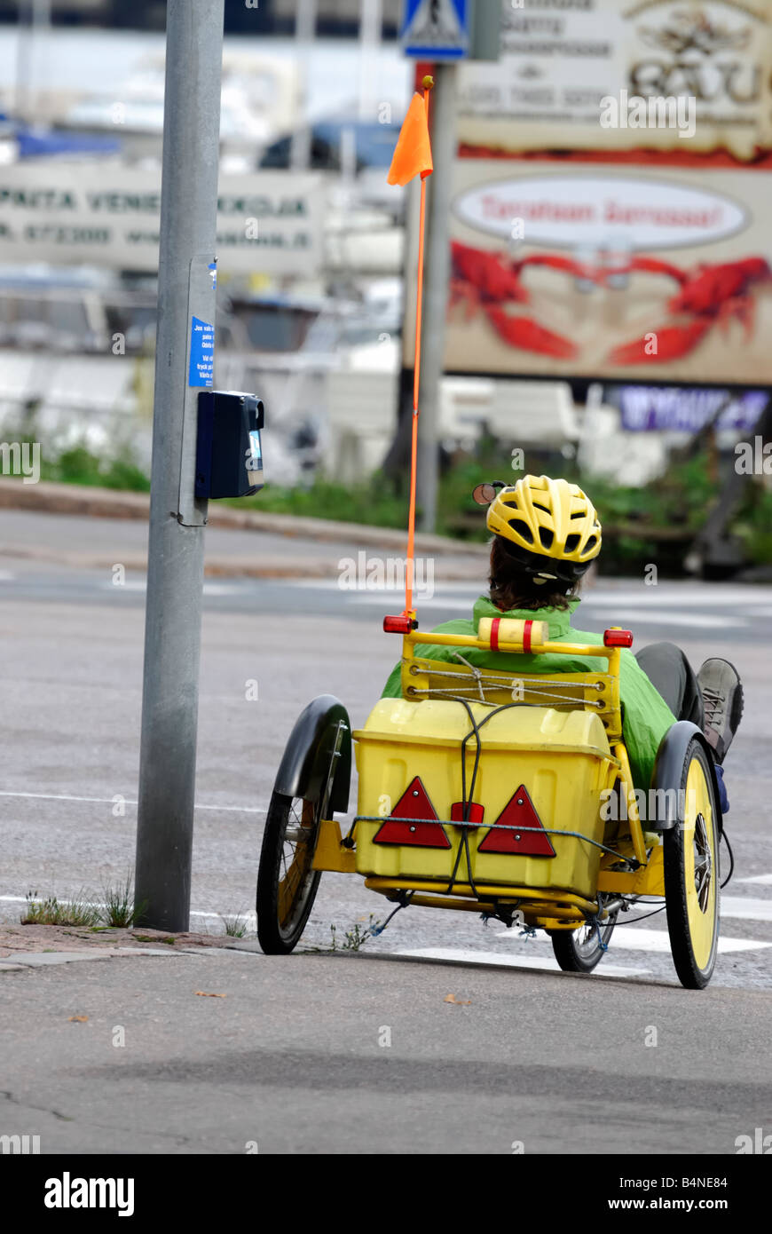 A woman in bicycle carriage before crossing the road Helsinki Finland