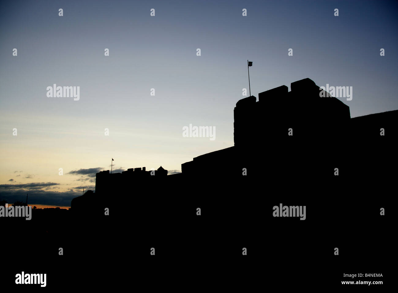 City of Carlisle, England. Silhouetted view of the south façade of the historic and ancient fortress of Carlisle Castle. Stock Photo