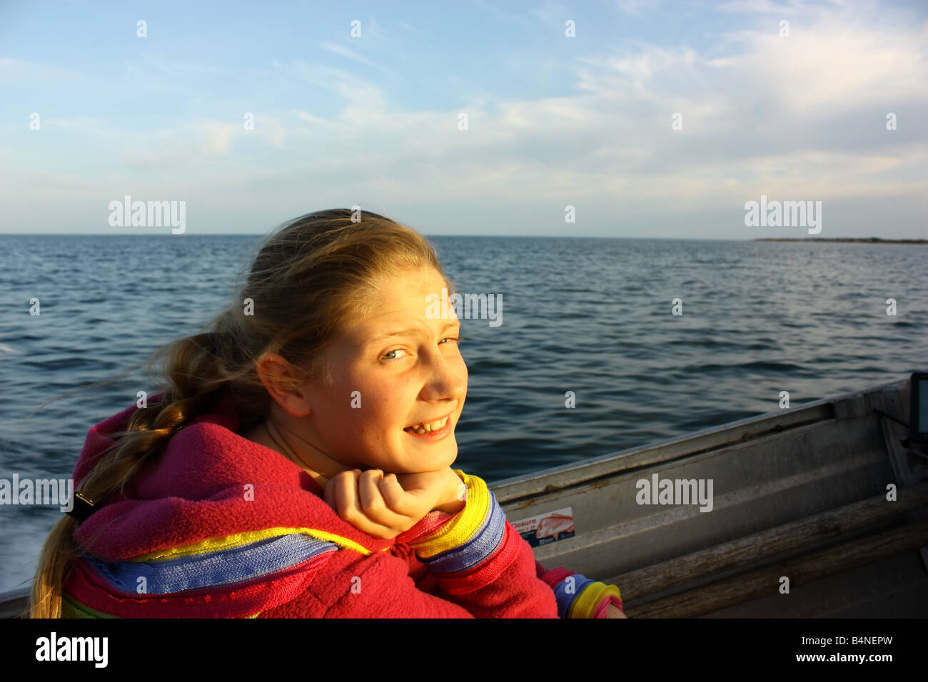 a child on a boat at sea Stock Photo