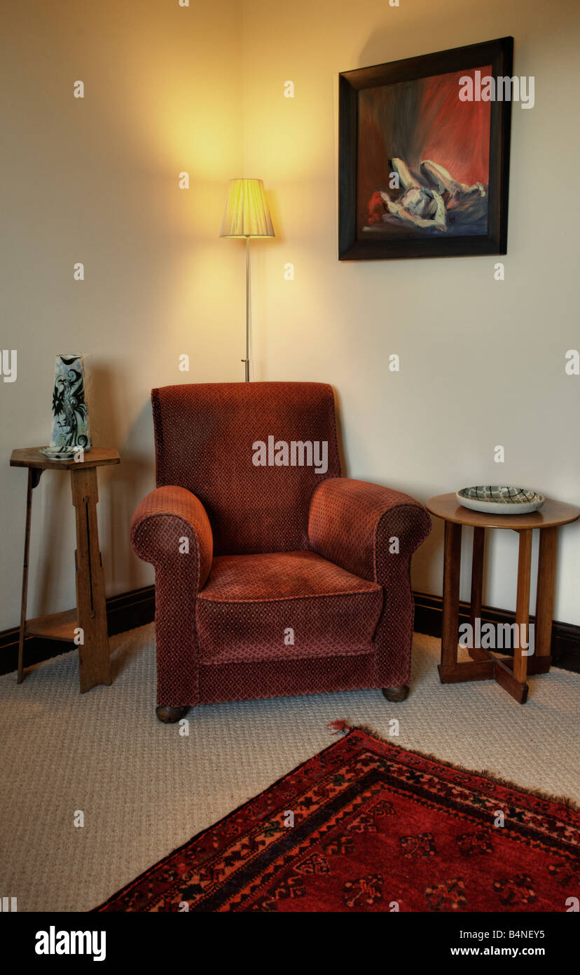 Armchair in living room with rug Stock Photo Alamy