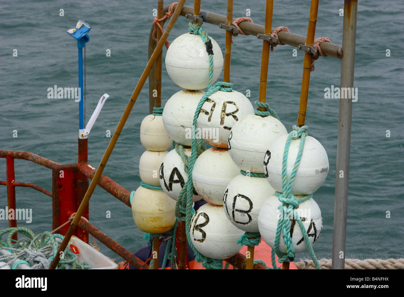 fishin net marker buoys on rear of boat at streaky bay Stock Photo